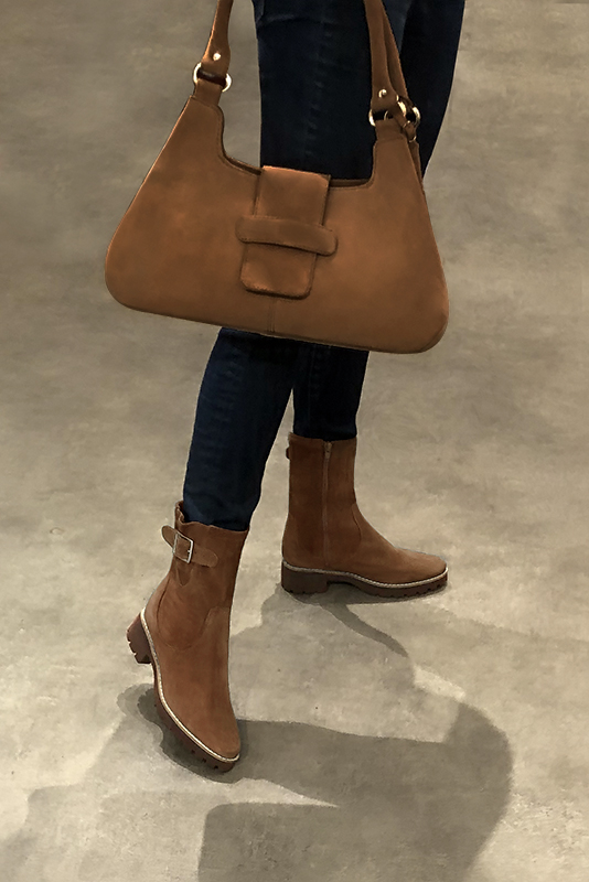 Caramel brown women's ankle boots with buckles on the sides. Round toe. Low rubber soles. Worn view - Florence KOOIJMAN